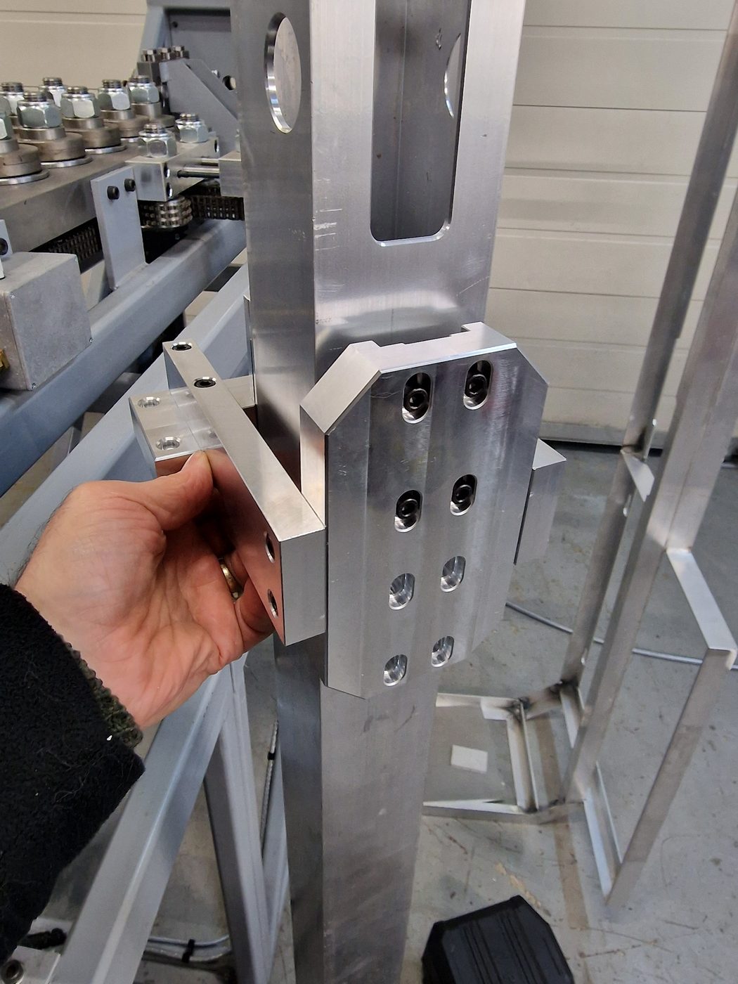 Bespoke aluminium mechanism being fitted during equipment build work