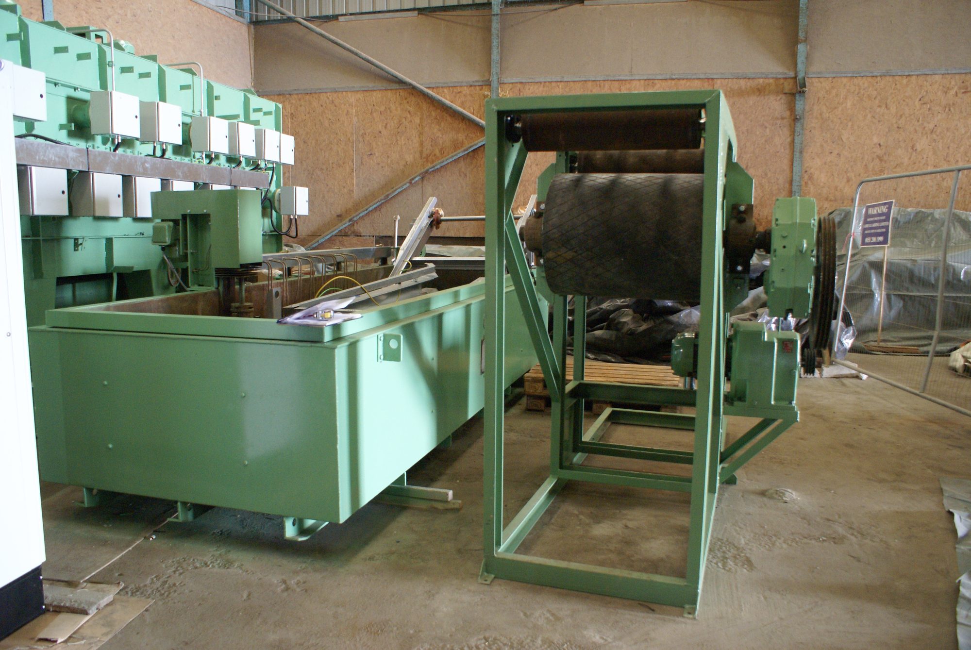 Belt feed and quench tank area on the austempering furnace line