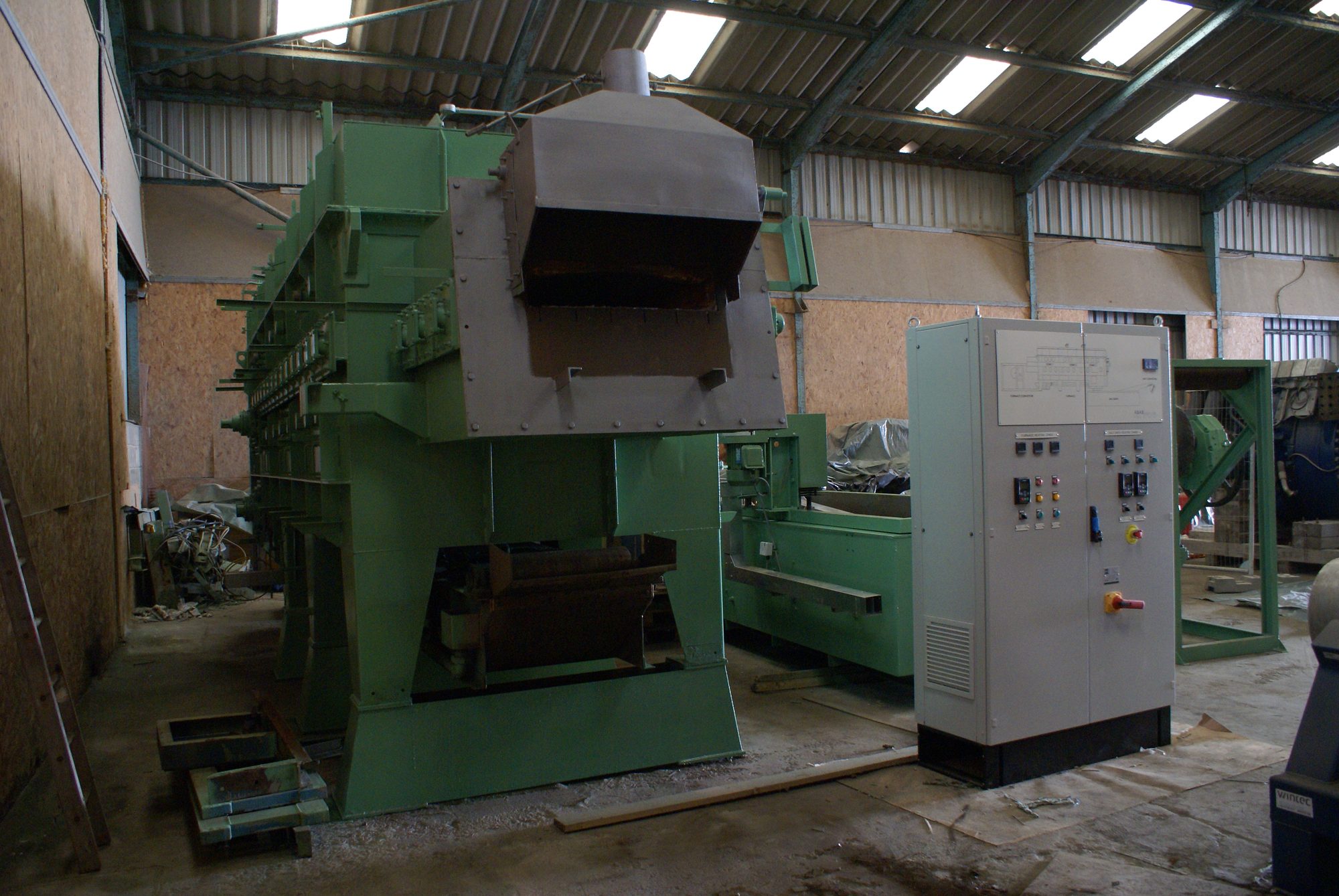 Front view of the refurbished belt-fed austempering furnace
